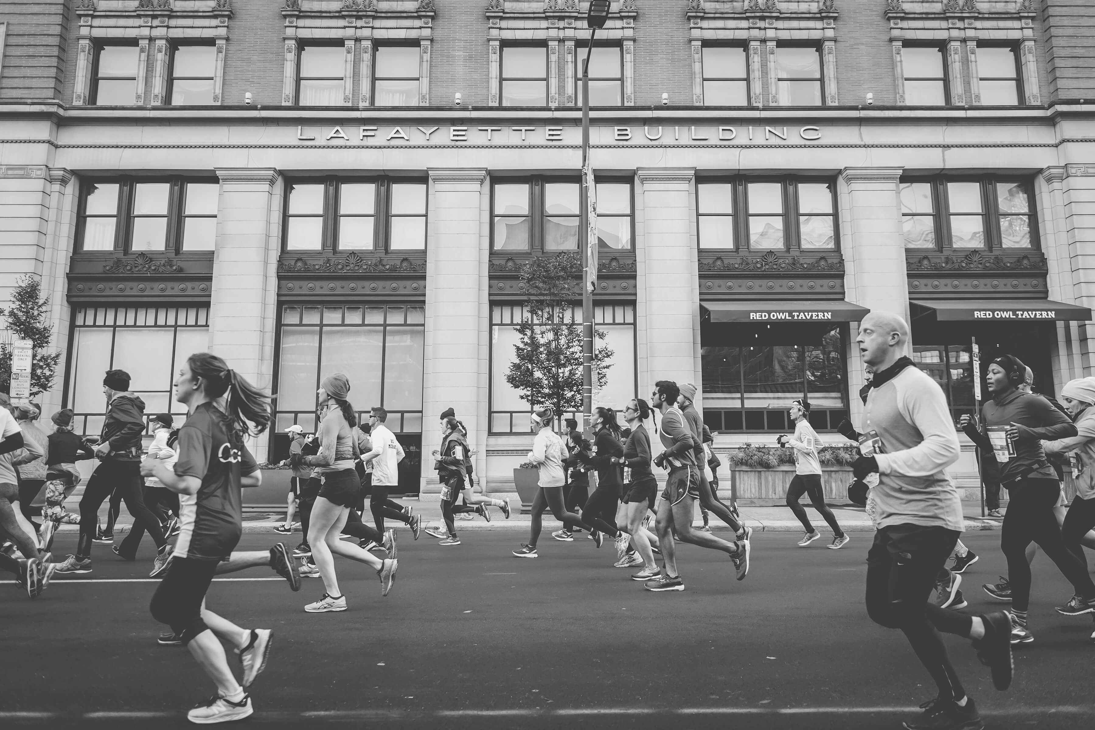 Marathon Runners on a Paved Road